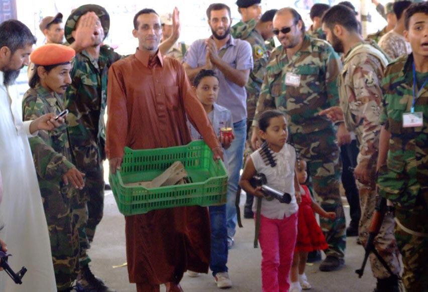 Carnival atmosphere in Benghazi as weapons collection gets underway