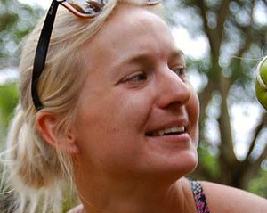 Detained Australian aid worker returns home