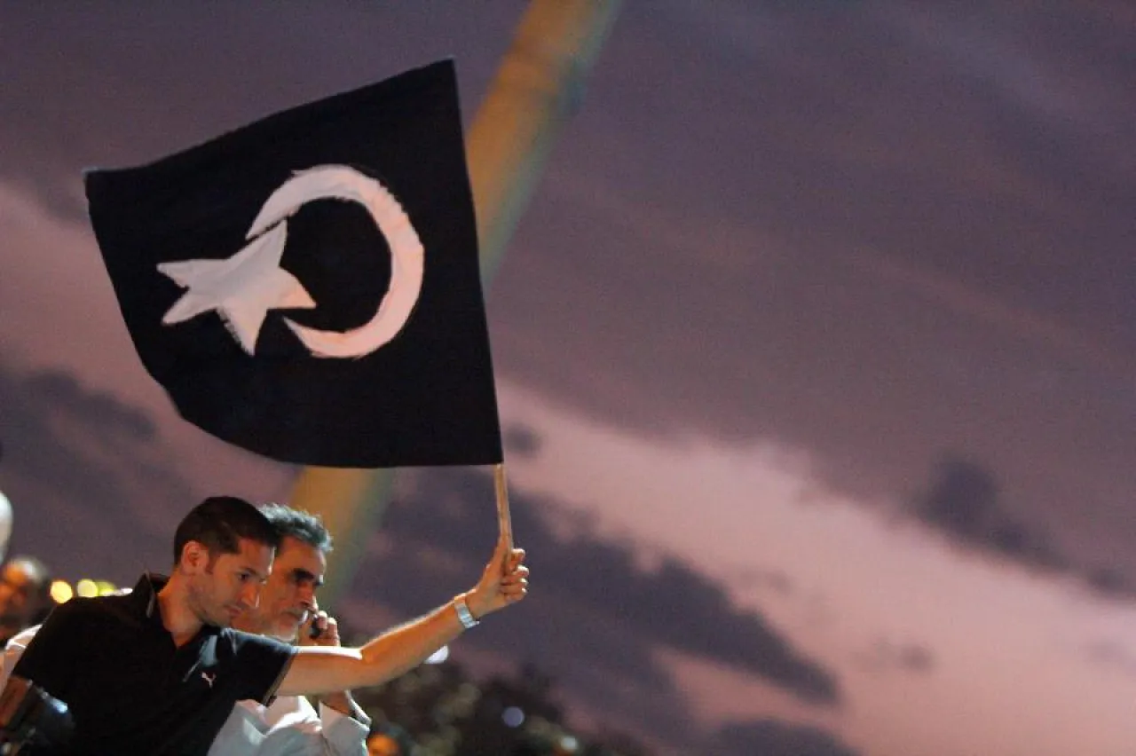 CyrenaicaFlag A protester waves the black flag of Cyrenaica during a pro-federalism rally in Benghazi on 2 November.
