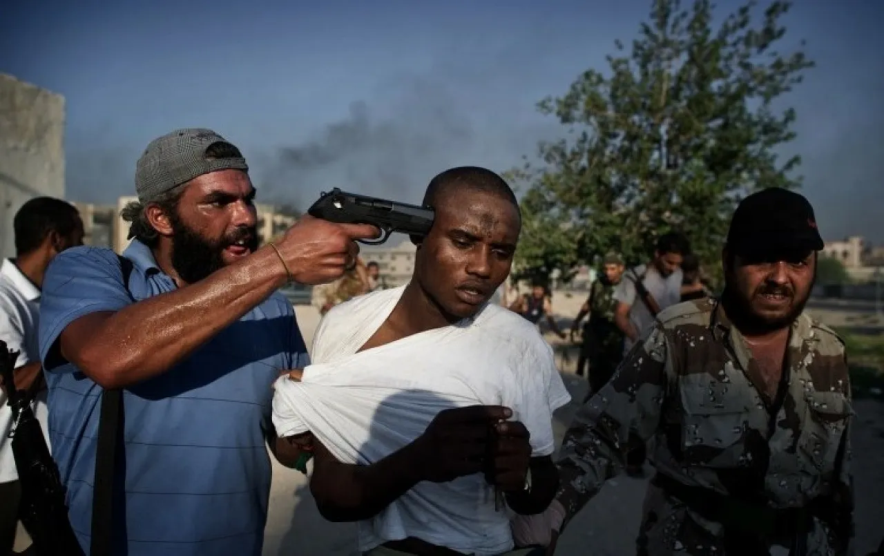 end of the line ? The late Rémi Ochlik's compelling picture of a suspected mercenary, after his capture