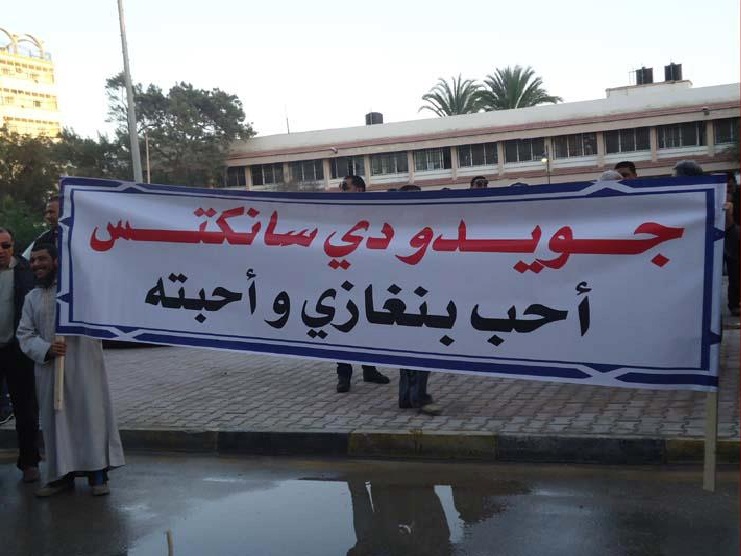 Posters in Benghazi proclaim that "Guido di Sanctis loves Benghazi and it loves him"