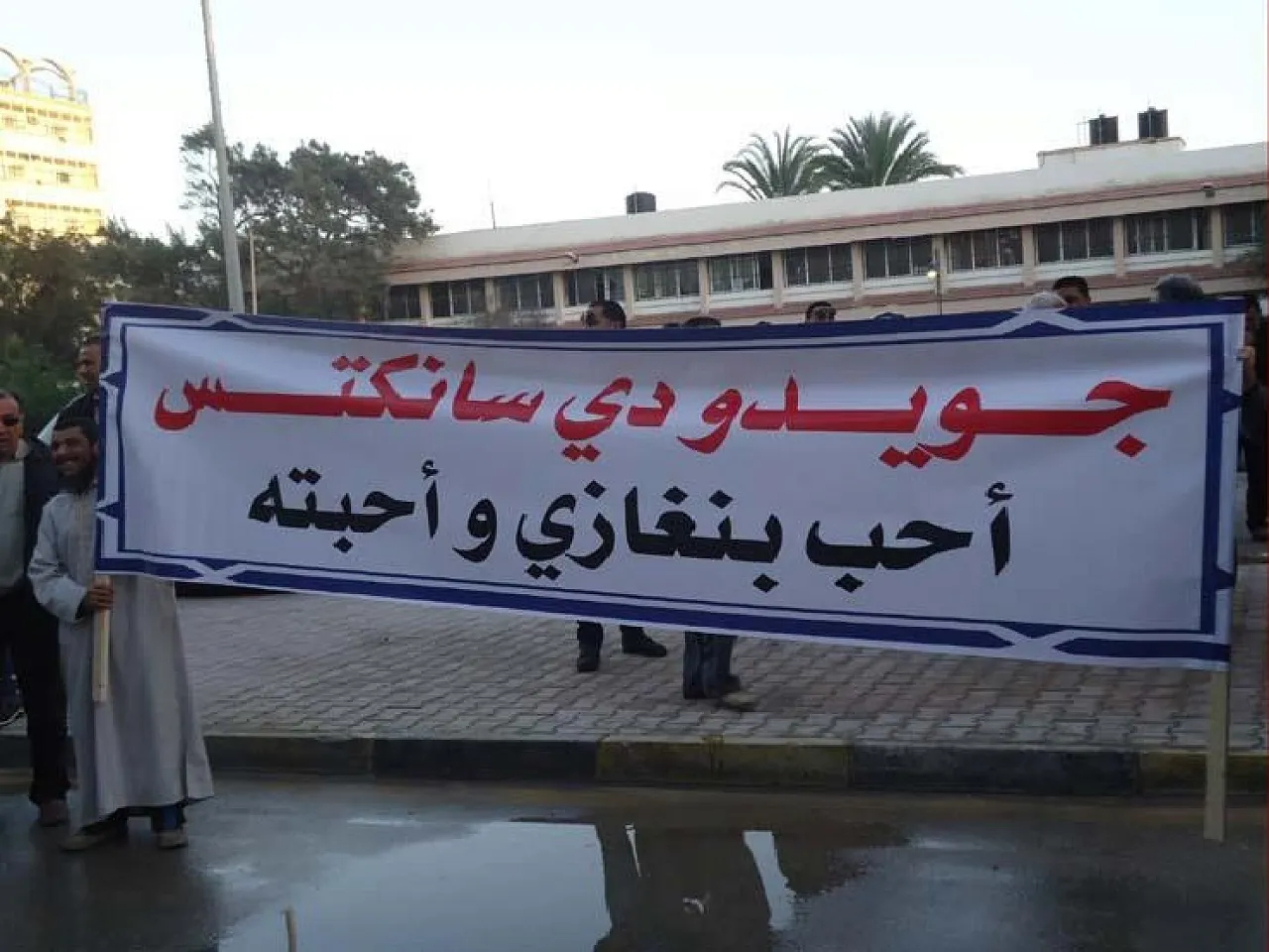 Posters in Benghazi proclaim that "Guido di Sanctis loves Benghazi and it loves him"