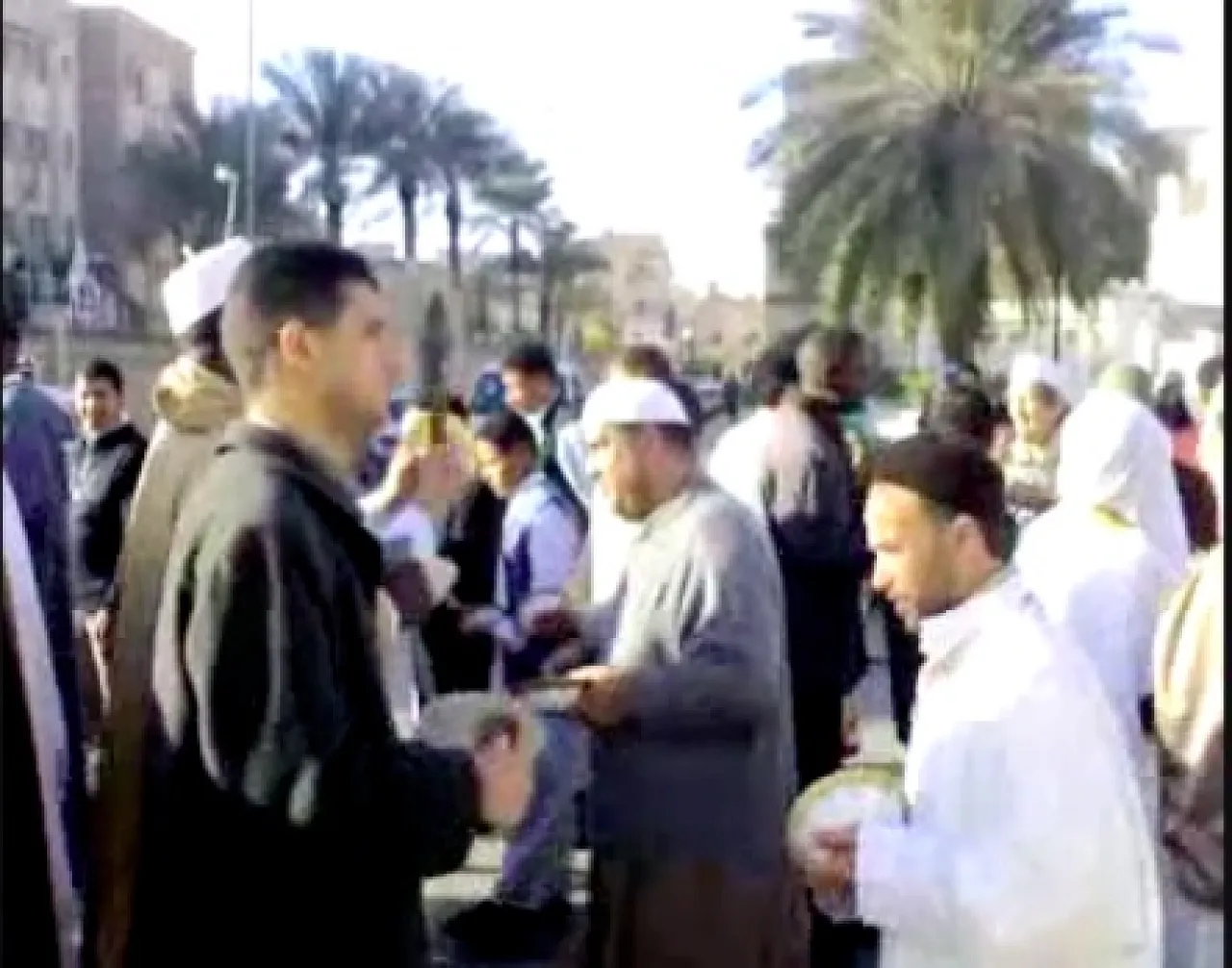 hadra Men in Tripoli chanting and drumming in a procession known as hadra.