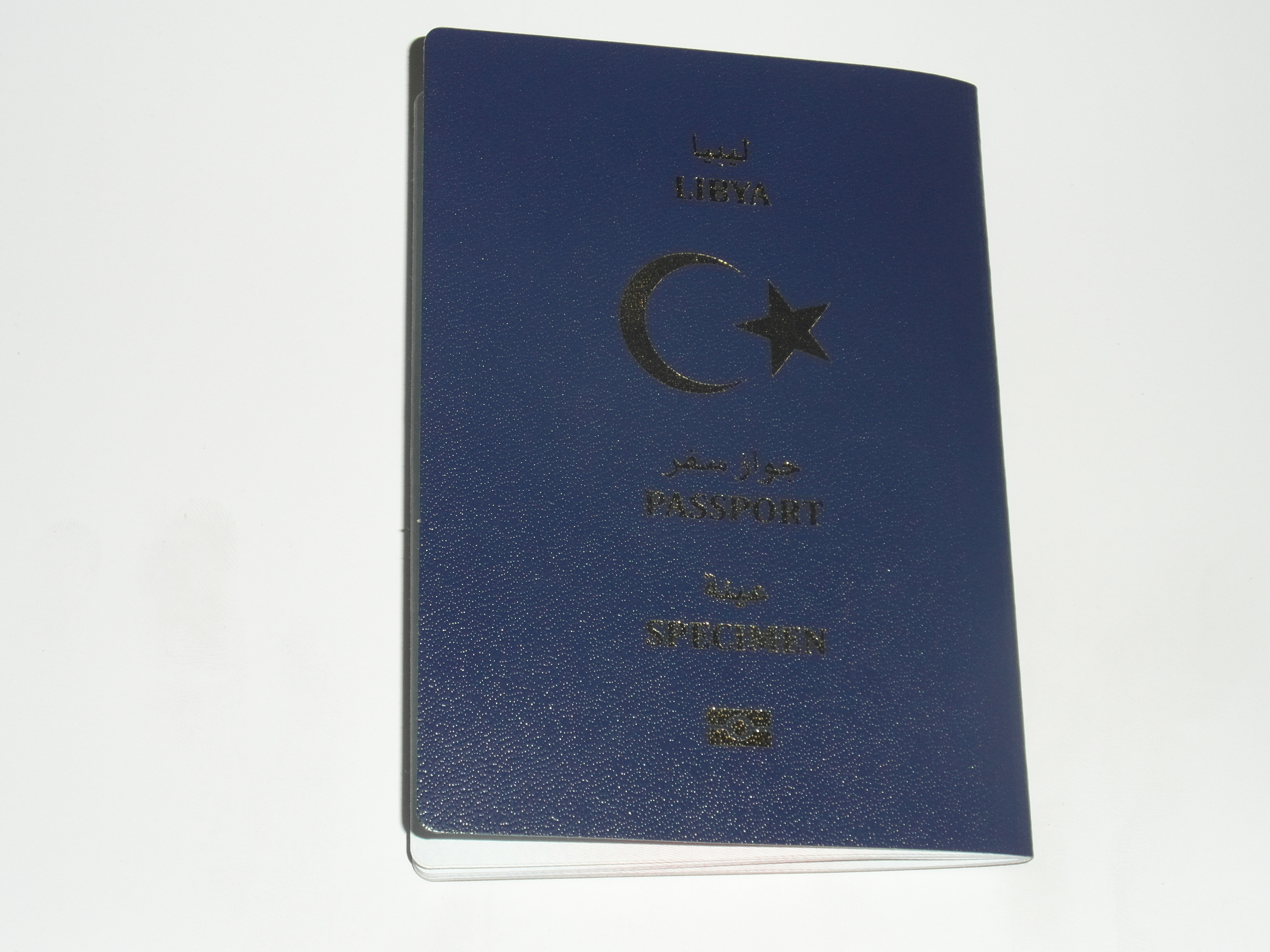 the new Libyan passport-070213 The new, blue in colour, biometric Libyan passport with crescent and star (Photo: Sami Zaptia).