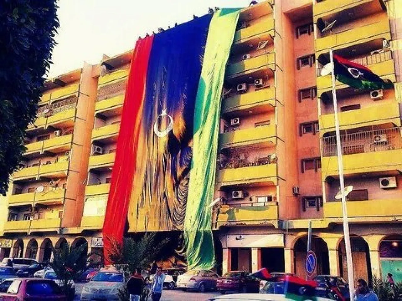 65589_464095213640308_1357653475_n Tripoli is festooned with flags