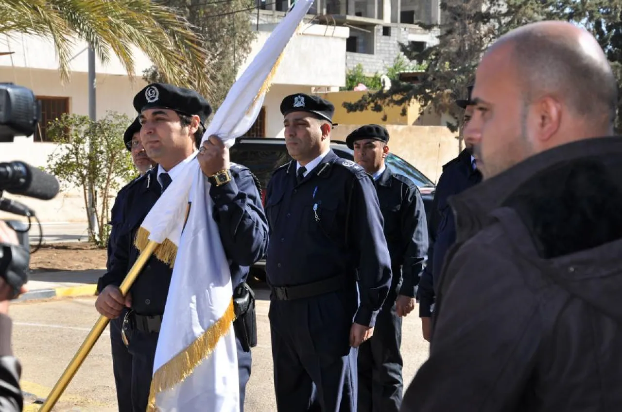 Flag of the old CID being handed over to the new CCA