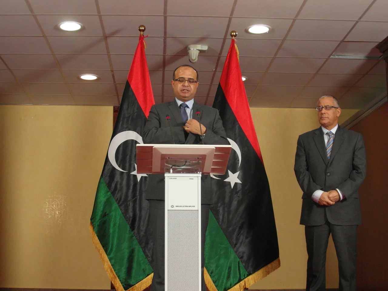 The then Deputy Prime Minister and Electricity Minister Awad Barasi during a press conference in Tripoli with his Prime Minister Ali Zeidan in 2013 (Photo: Sami Zaptia).