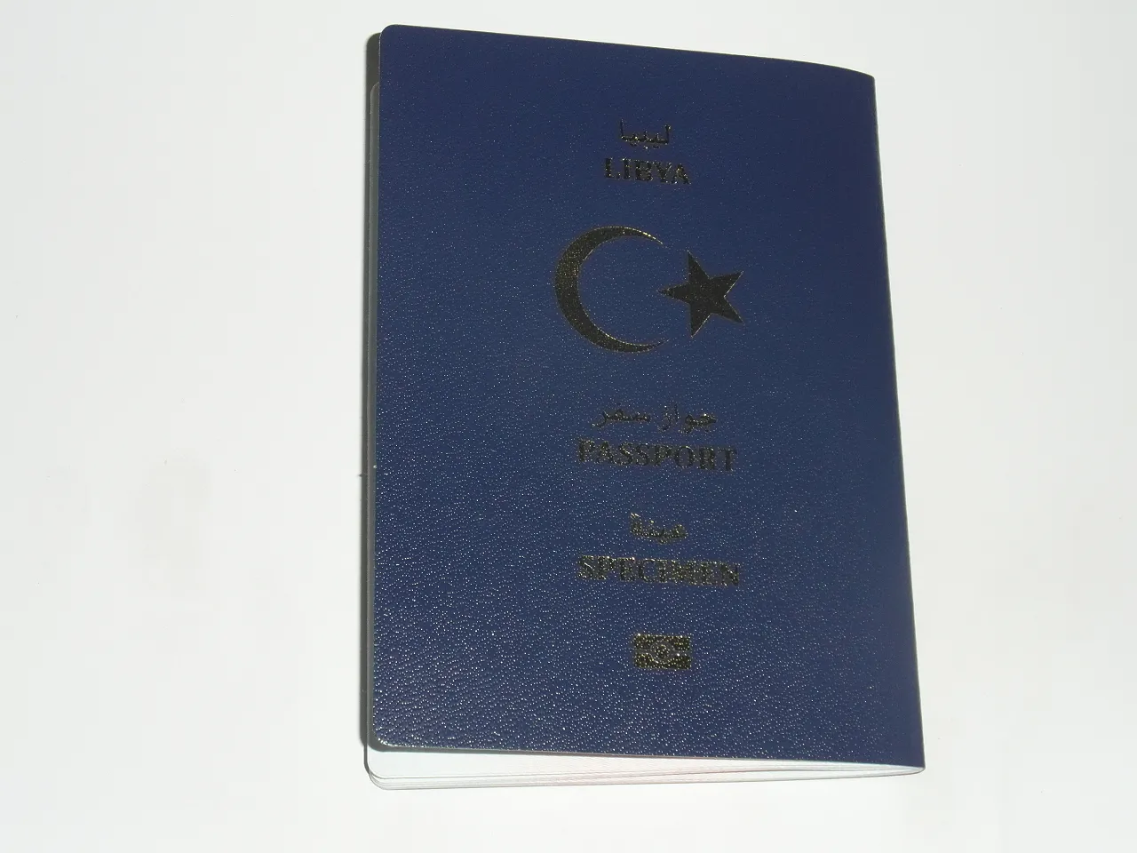the new Libyan passport-070213 The new, blue in colour, biometric Libyan passport with crescent and star (Photo: Sami Zaptia).