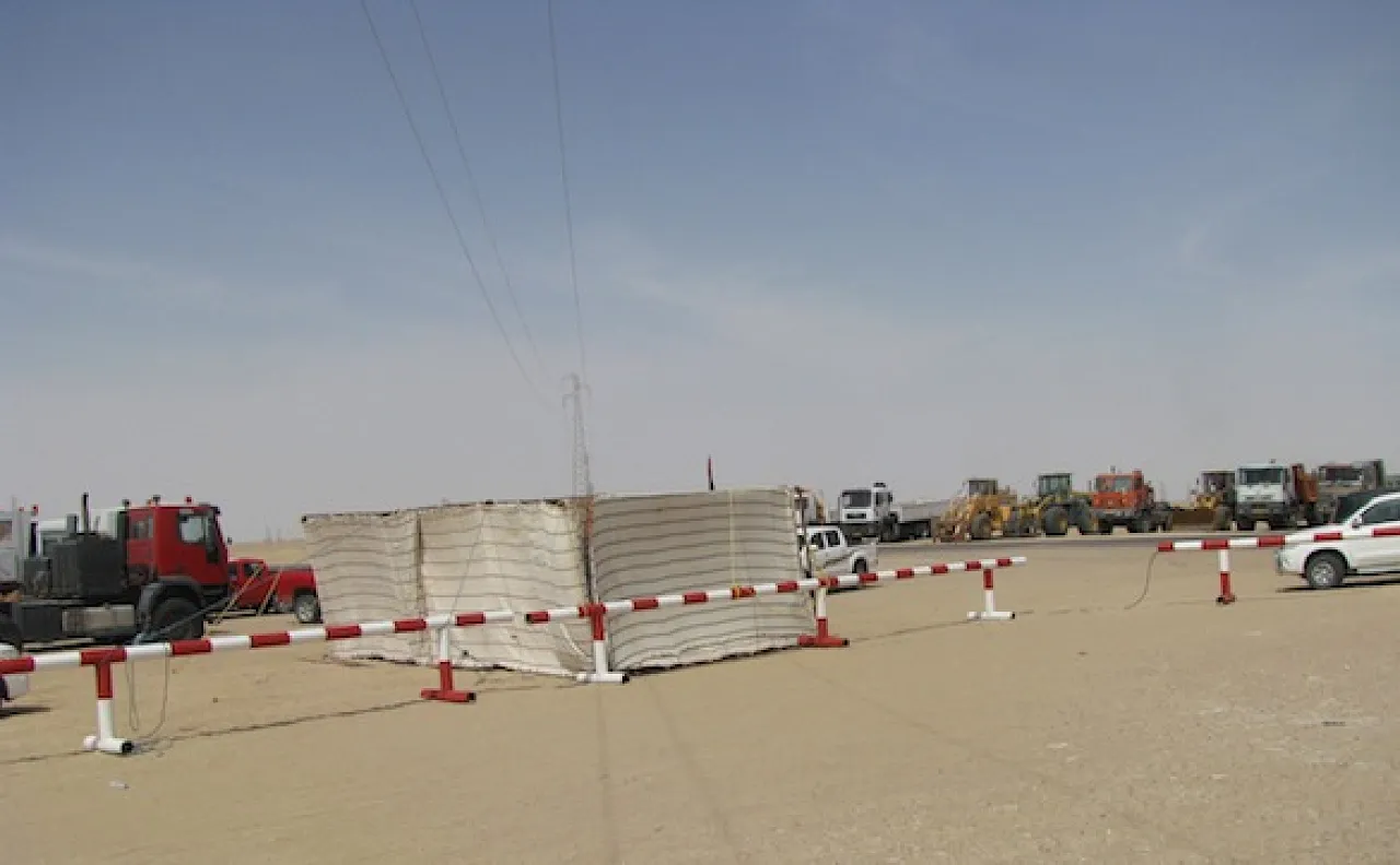 Gialo 6 Protestors vehicles at the entrance to Gialo 59 oilfield