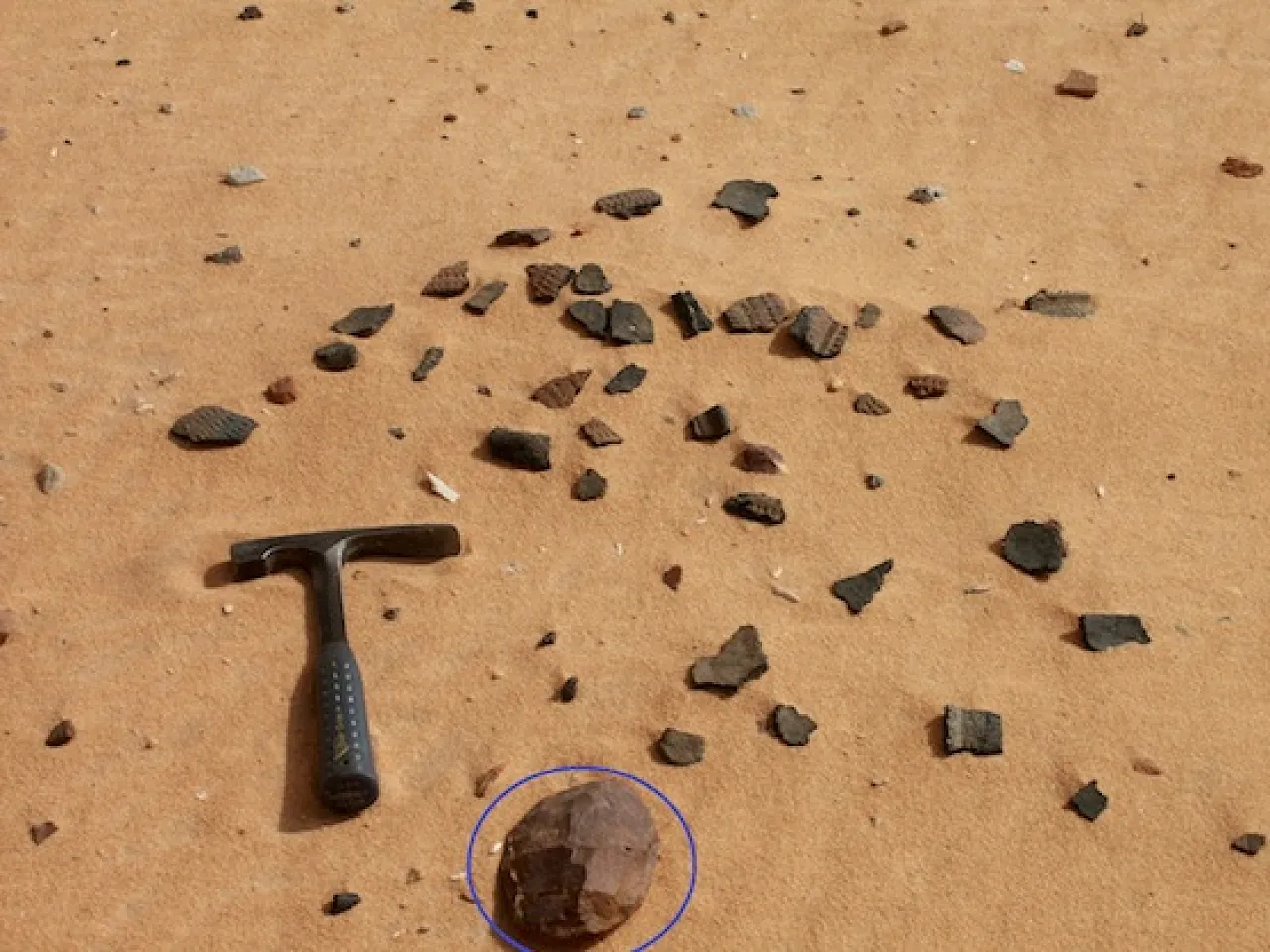 DCF 1.0 Scattered pottery and a hand axe