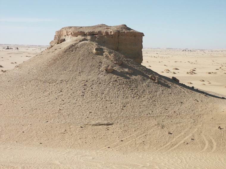 Figure 4: Examined sediments consist of lacustrine limestone deposited in humid periods (top ledge), inter-bedded with Aeolian sands deposited in arid periods (bottom soft sediments). Similar deposits are scattered in the area of Wadi ash Shati, Wadi Barjuj and Wadi Nashu.
