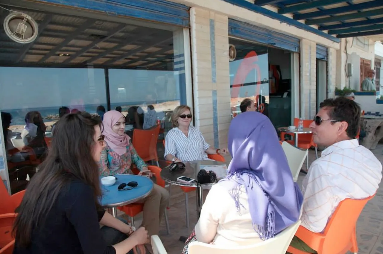US Ambassador Deborah Jones (centre) with others at a Tripoli beachside café