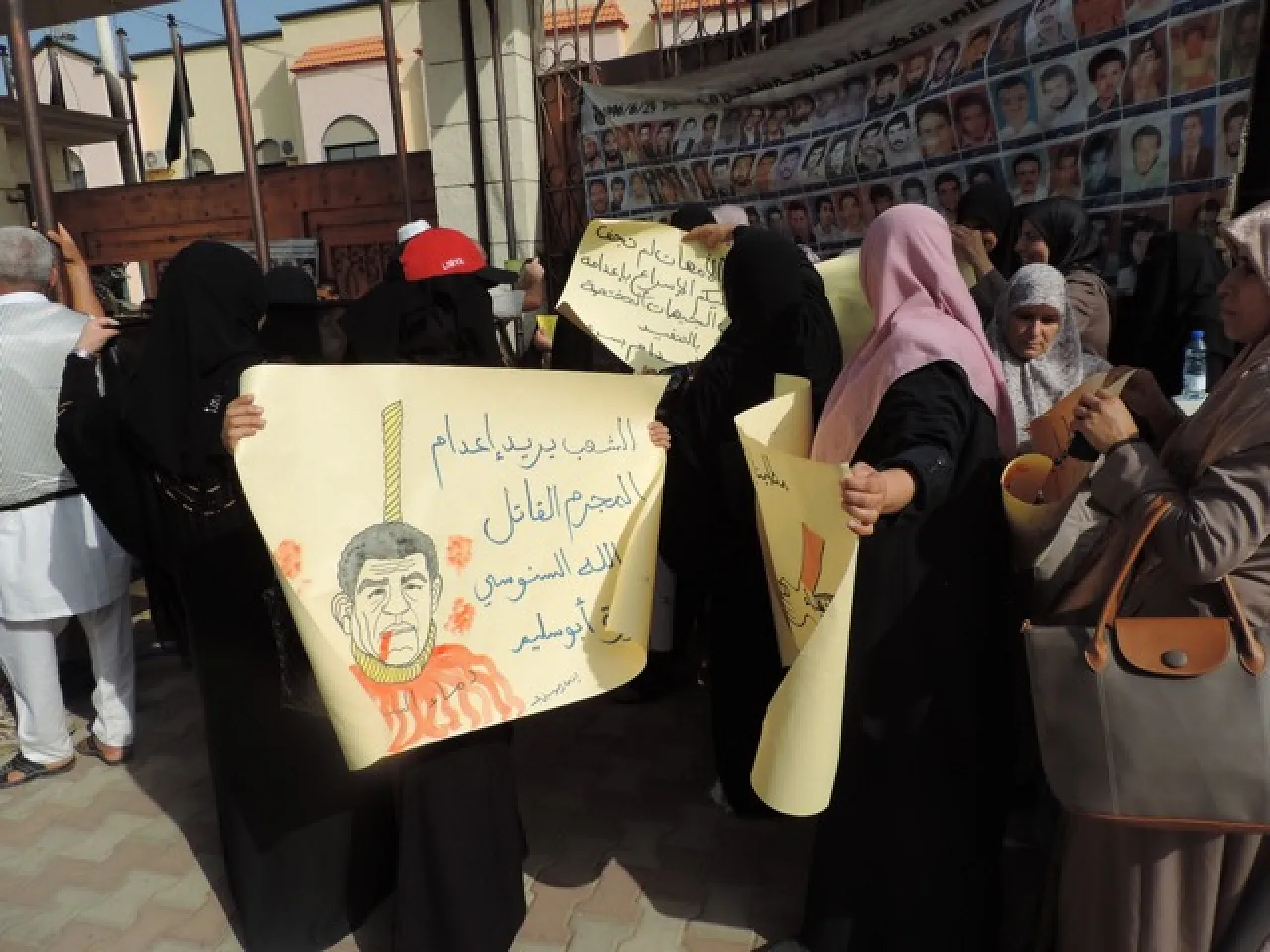 Protestors outside the court wanted Abdullah Senussi to be hanged