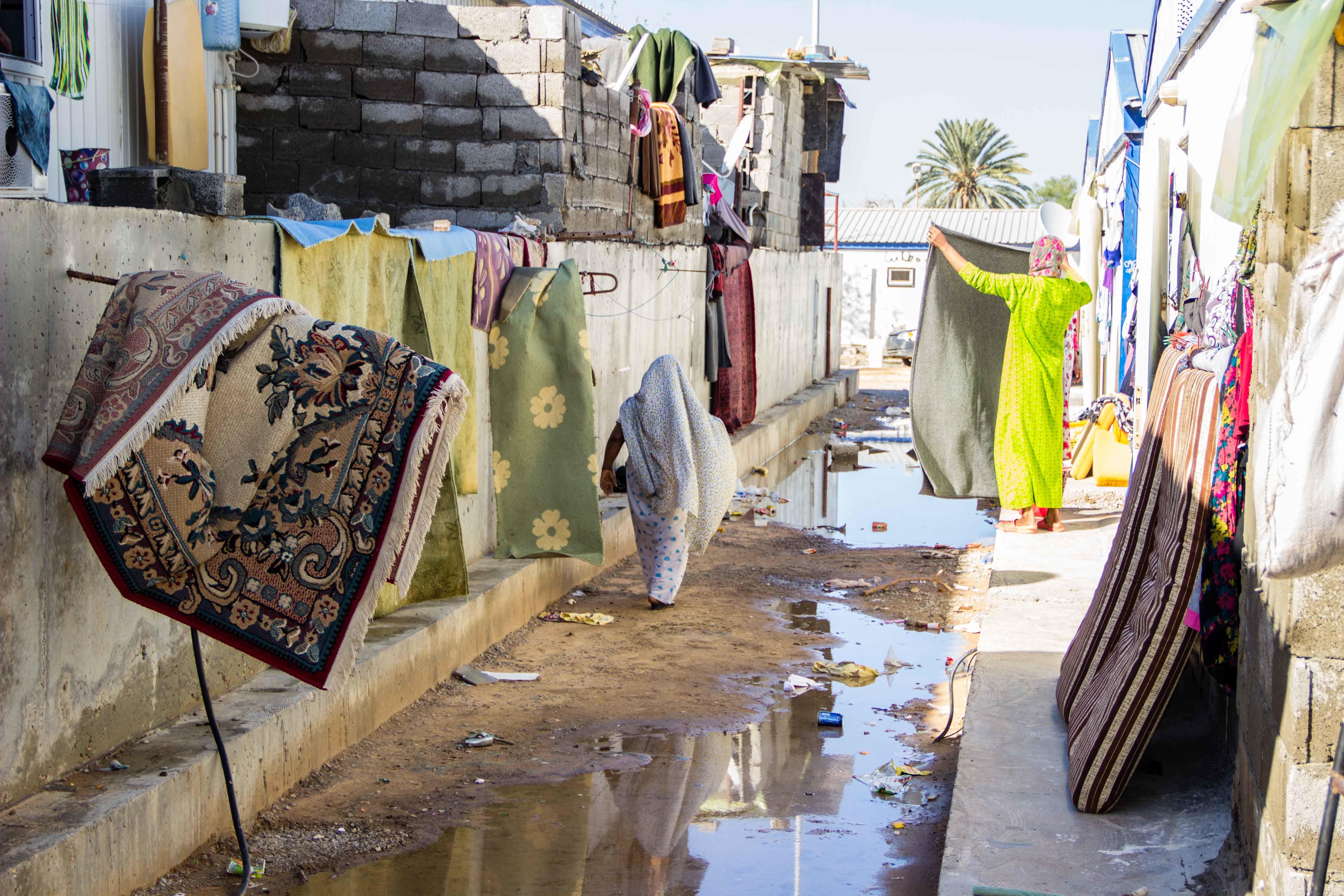 Tawerghans struggle to dry out flooded camps