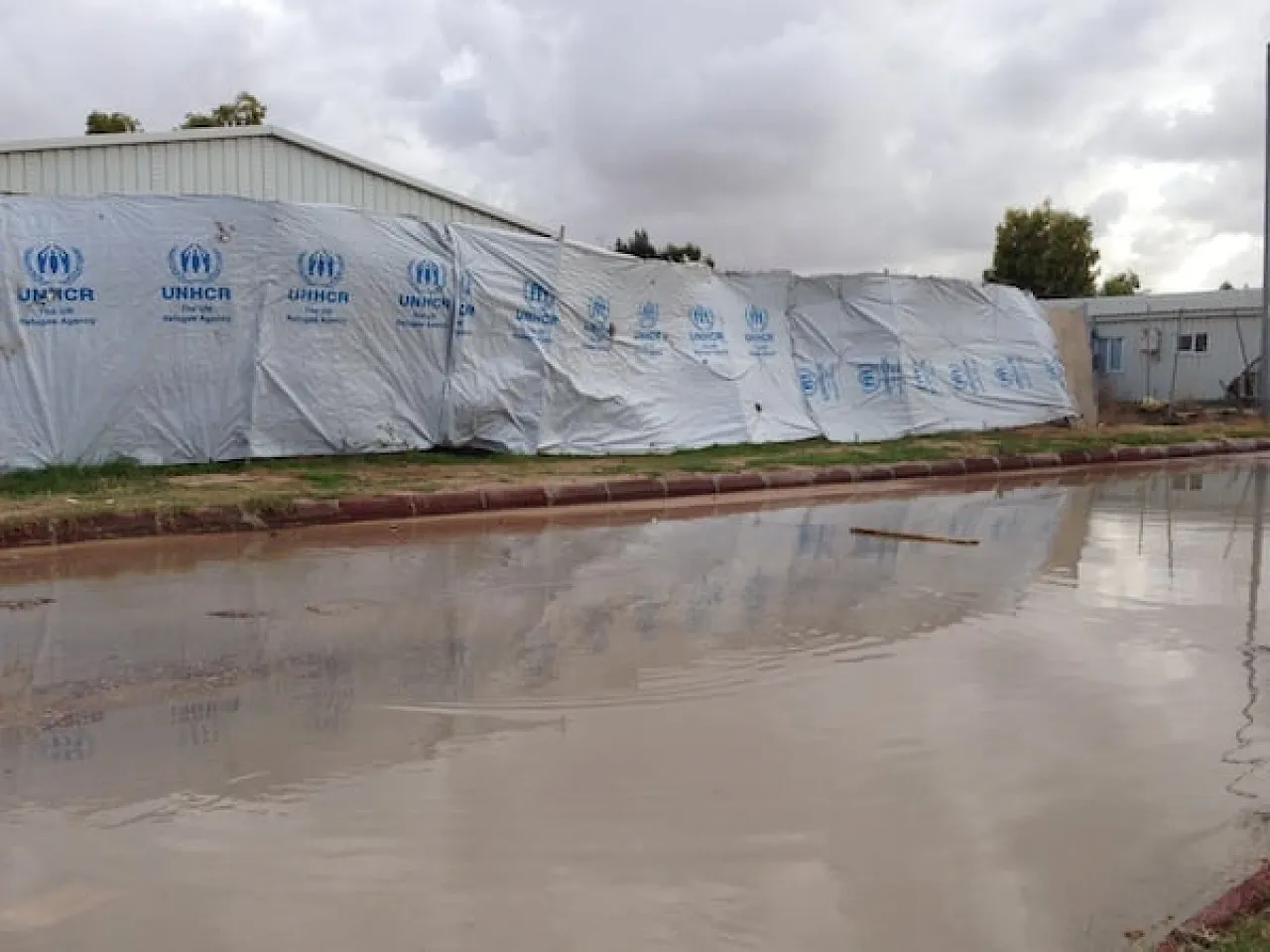 A flooded road in one of the Tawergha camps in the capital