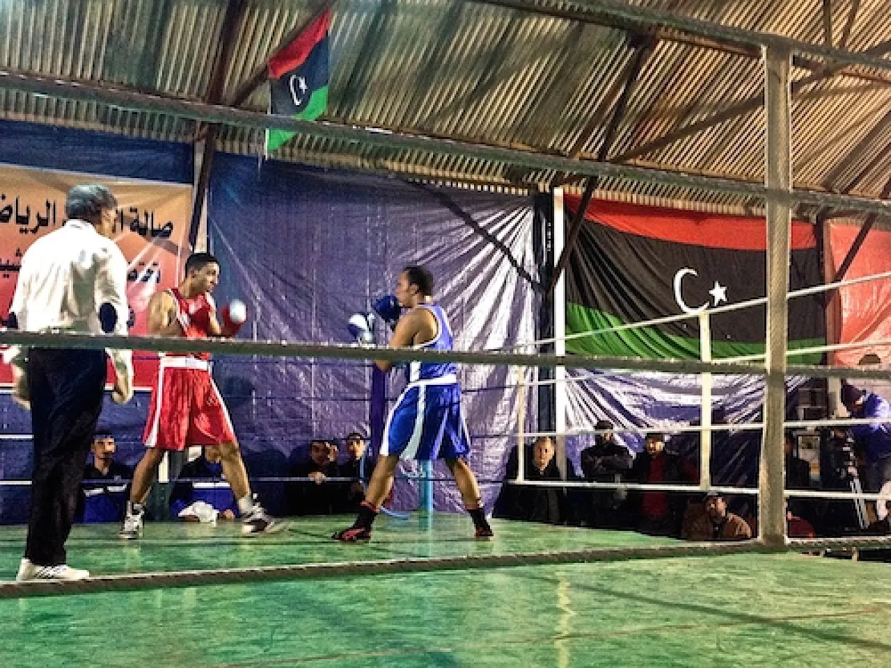 Two fighters square up to one another in the ring