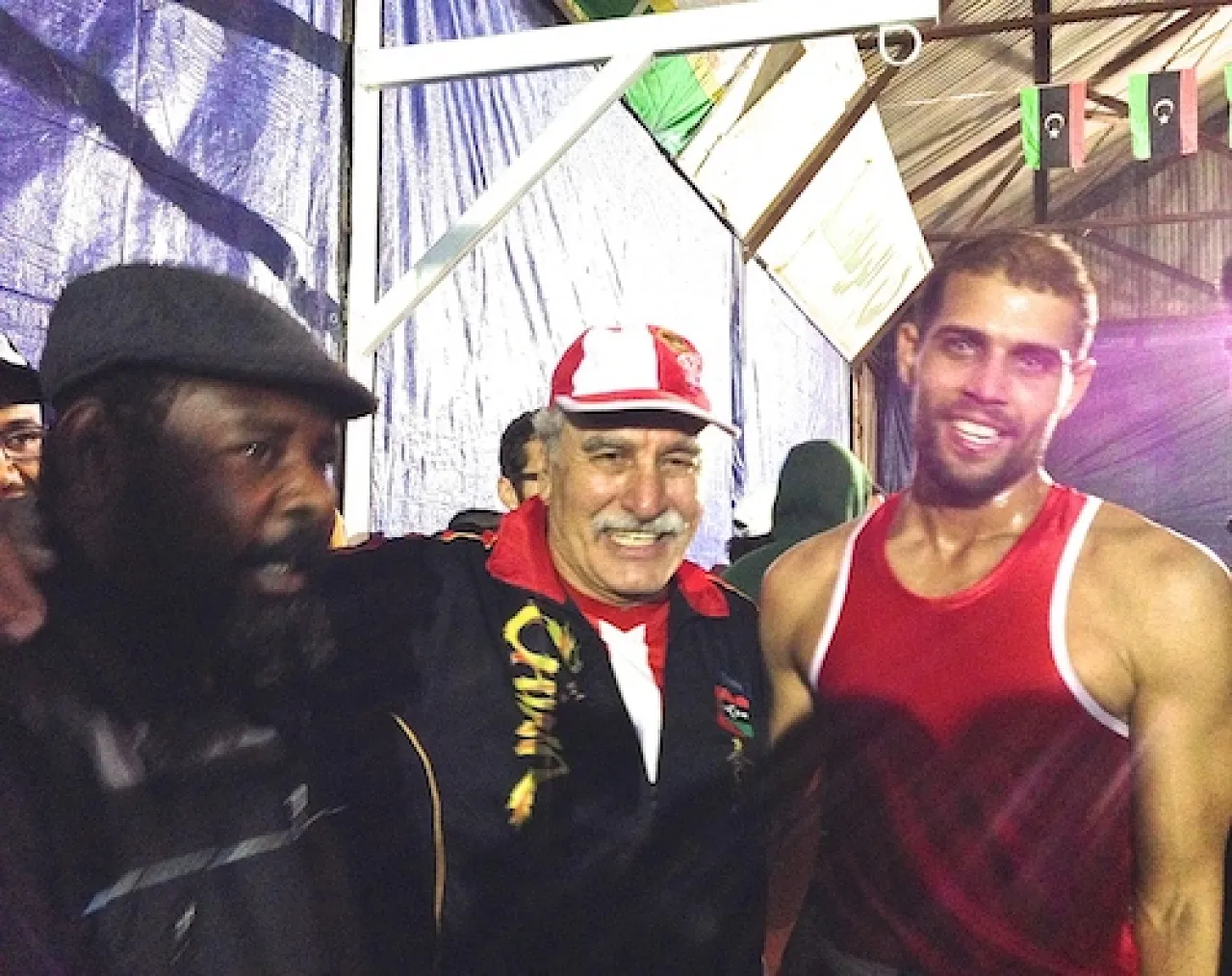 Ittihad coaches Sabri Al-Aswad and Mahmoud Boshkewa with fighter Osama Mohamed Maghboub