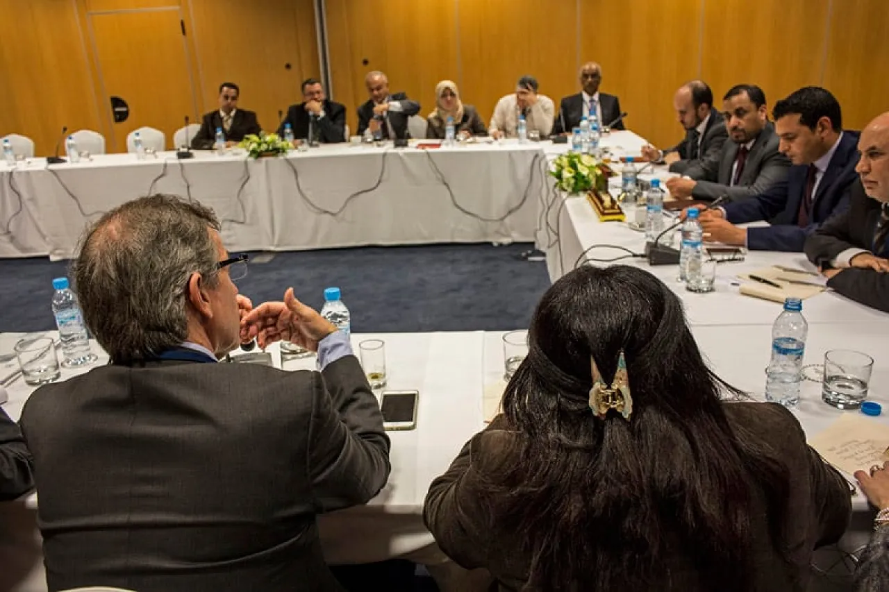Bernardino Leon (back to camera) explains a point during one of the separate dialogue sessions this evening (Photo: UNSMIL)