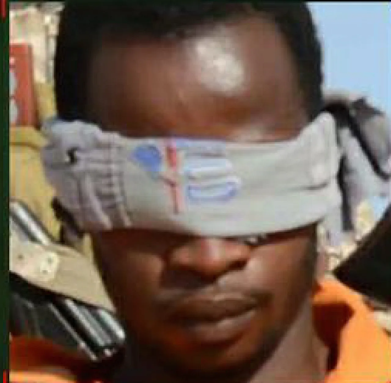 Ghanaian hostage Sekyere, seemingly wearing an orange jumpsuit