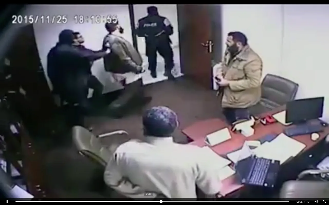 Mohamed Atkitek is led from his office by Rada men  
