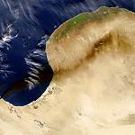 Black plumes from oil tank fires seen from space