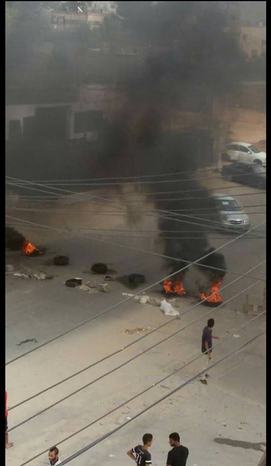Youth burning tyres as part of demonstrations against extended power cuts inn Tripoli this summer (Photo: Social Media).