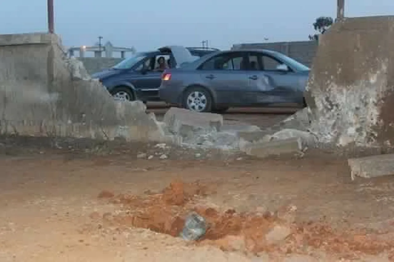The rocket explosion blew down a wall and left a crater (Photo: social media)