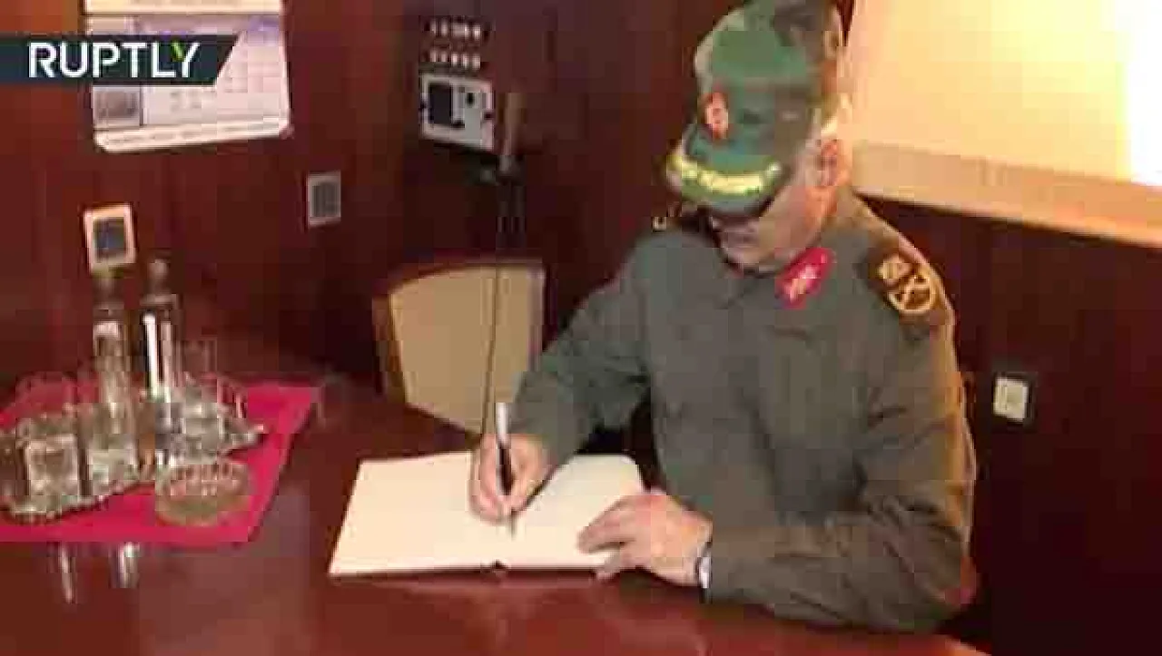 Khalifa Hafter signs a visitors book or an arms contract?