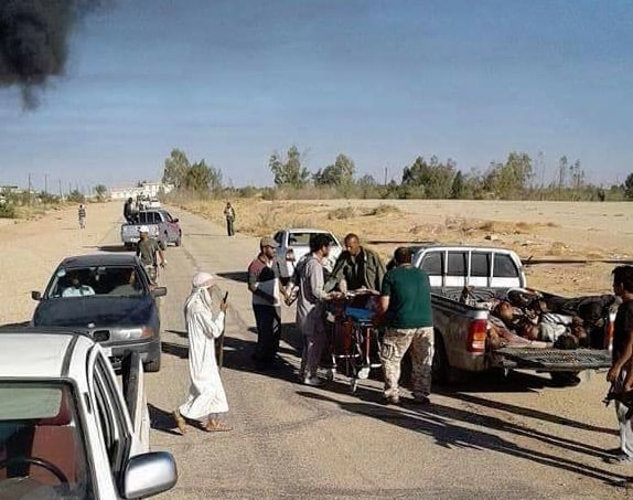 Bodies being removed after the Brak Al-Shatti attack