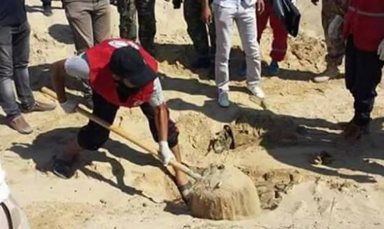 Body of Air Col. Orifi being dug up (Photo: LNA)