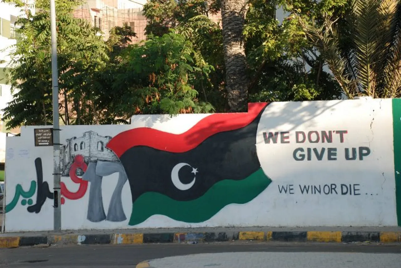 The 17 February 2011 Revolution graffiti and murals used unifying themes such as this famous quote attributed to anti colonial fighter Omar Mukhtar ''We dont give up. We win or we die'' (Photo: ‘‘Artistic imprints on the walls of Free Libya Facebook page’’)
