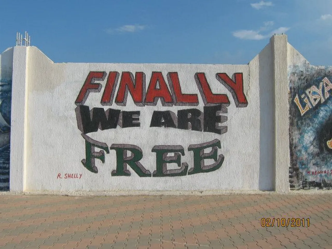 With the advent of the 17 February 2011 Revolution and the overthrow of the Qaddafi regime, Libyans at the time considered themselves to be free. Many mini civil wars, two elections and ten years later, they still seek stability and development (Photo: ‘‘Artistic imprints on the walls of Free Libya Facebook page’’).