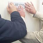 Tripoli Municipality Centre started attaching postcodes on buildings